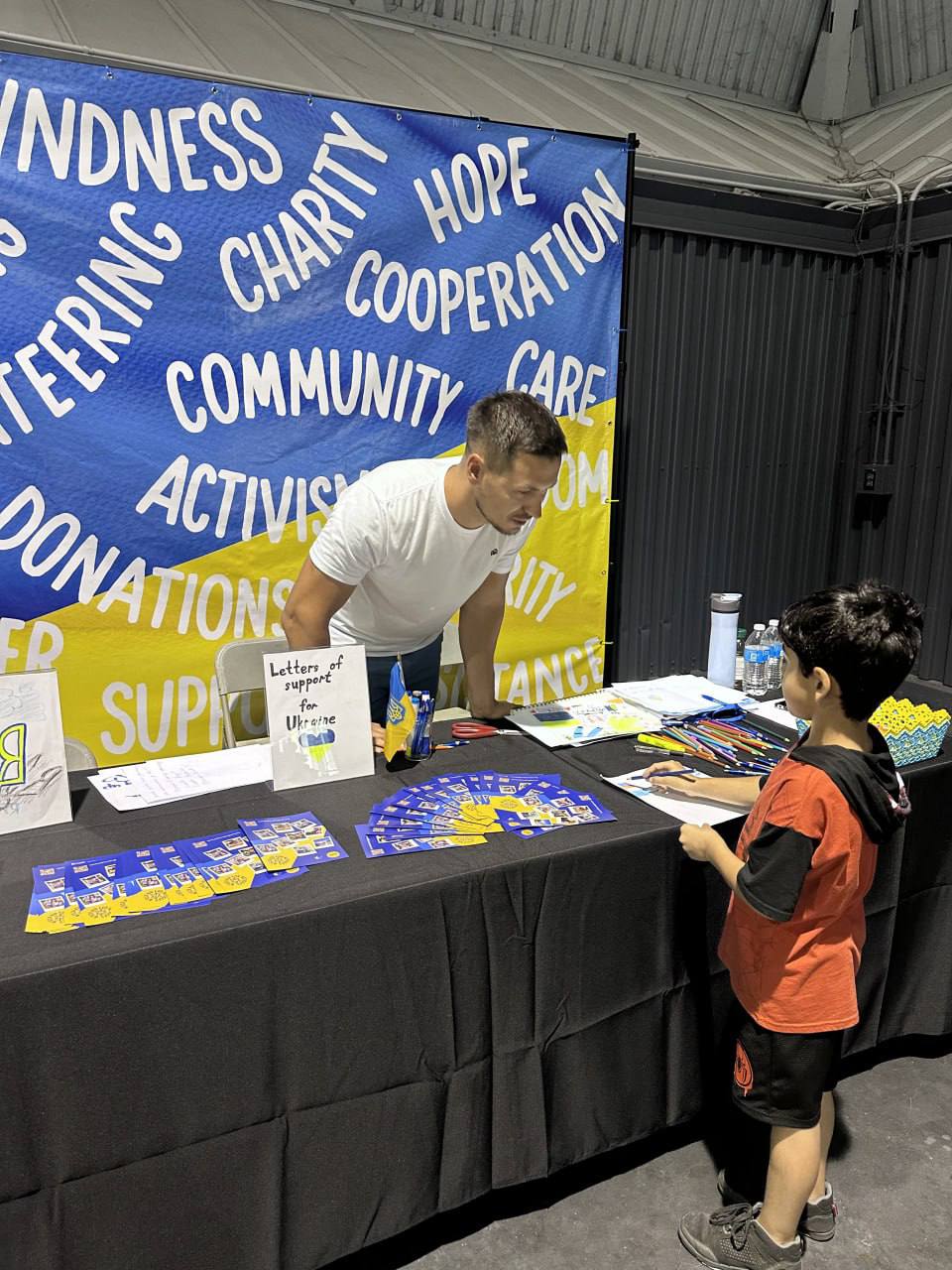 Children examine cultural displays at an "Around the World Festival" booth.